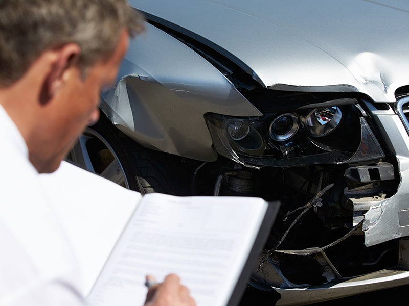 advisor inspecting vehicle photo